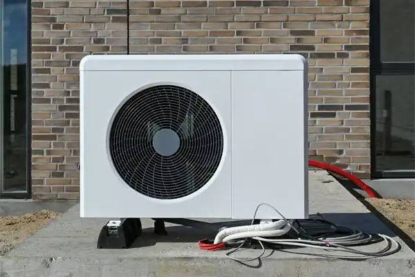 A Heat pump outside a brick building